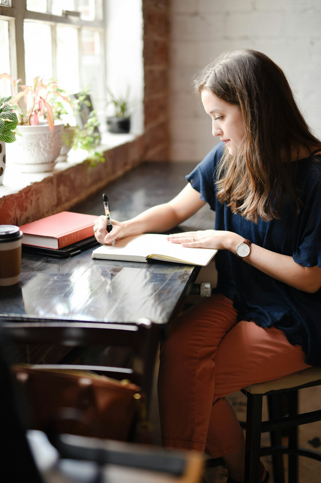 woman writing in journal