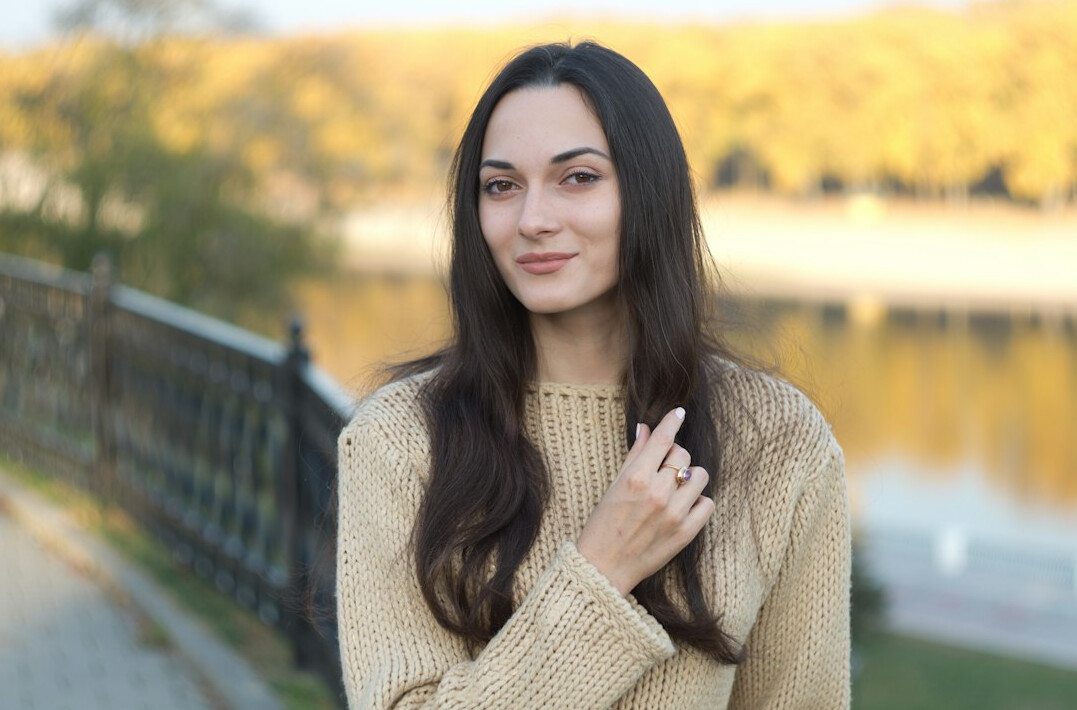 Portrait of a smiling young woman with long dark hair